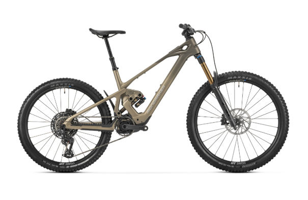 Olive-colored full-suspension electric mountain bike with a mid-drive motor, large knobby tires, disc brakes, and a dropper seat post against a white background.